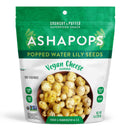 A green and white bag of Asha Pops contains popped water lily seeds flavored with vegan cheese, showcasing a bowl of the crunchy snack on the front, labeled as gluten-free and handcrafted in L.A.