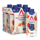 A pack of four Atkins high protein strawberry shakes is shown, featuring a single shake on the side, highlighting nutritional information like 15g protein and 2g net carbs.