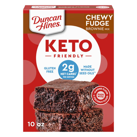A box of Duncan Hines Keto Friendly Chewy Fudge Brownie Mix features two stacked brownies, highlighting gluten-free and low-carb benefits with a red and white design.