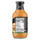 A bottle of zero-sugar sauce displays nutritional information on its black label, highlighting 80 calories per serving and featuring a colorful image of a burger.