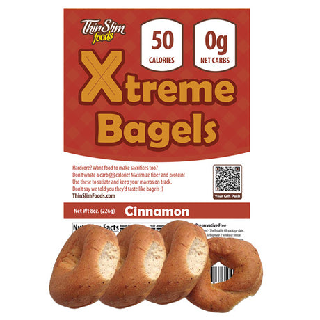 A package of Thin Slim Foods Xtreme Bagels in cinnamon flavor, featuring four bagels at the bottom, with a label highlighting 50 calories and 0 net carbs.