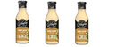 Three bottles of G. Hughes Honey Dijon flavored dressing are displayed, each featuring a black label with white text, highlighting its zero sugar, gluten-free, and dairy-free attributes.