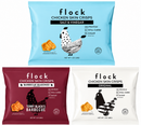 Three bags of Flock Chicken Skin Crisps are displayed: one blue labeled "Salt & Vinegar," one red labeled "Barbecue Seasoned," and one white labeled "Original," each featuring a chicken graphic and nutritional information.