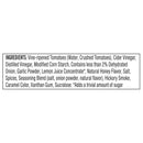 A list of ingredients for a food product, including vine-ripened tomatoes, various vinegars, spices, and flavorings, presented in a black box format with detailed descriptions of each component.