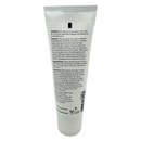 A white tube of moisturizing cream displays detailed product information on the back, highlighting its benefits for dry skin and ingredients like wheat germ oil and vitamin E.