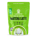 Bright green packaging of Lakanto Monk Fruit Sweetened Matcha Latte powdered drink mix features a decorative design, product name, and highlights like sugar-free, vegan, and probiotic benefits.