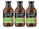 Three bottles of G. Hughes Mesquite Flavored BBQ Sauce are displayed, each featuring a green label with "Zero Sugar" and nutritional information, emphasizing that the sauce is gluten and dairy-free.