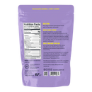 The back of a purple packaging for Lakanto Peanut Butter Powder displays nutrition facts, directions for use, and a brief history about monk fruit, emphasizing its health benefits and zero sugar content.