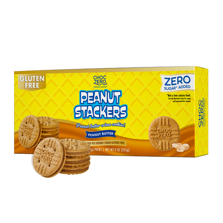 A box of ChocZero Peanut Stackers, gluten-free peanut butter crème cookies, is displayed with several cookies stacked in front, featuring bright yellow packaging and bold blue text.