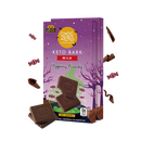 A colorful package of ChocZero Keto Bark Milk with popping candy features chocolate pieces in front, set against a whimsical purple background with Halloween-themed decorations.