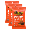 Three packages of Reese's Miniature Cups, labeled "Zero Sugar," feature bright orange packaging with nutritional information and images of the candy, emphasizing it's aspartame-free and 110 calories per serving.