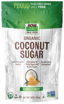 A green and white bag of NOW Real Food Organic Coconut Sugar features a coconut graphic, highlights its low glycemic impact, and states it is sustainably harvested and vegan.