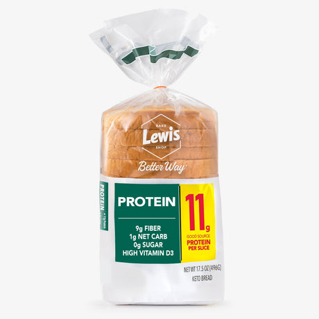 A clear plastic bag contains a loaf of Lewis Bake Shop protein bread, labeled with nutritional information highlighting 11 grams of protein per slice, 9 grams of fiber, and 1 gram of net carbs.