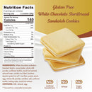 Gluten-free white chocolate shortbread sandwich cookies are stacked on a light background, with a nutrition facts label detailing ingredients and health information beside them.